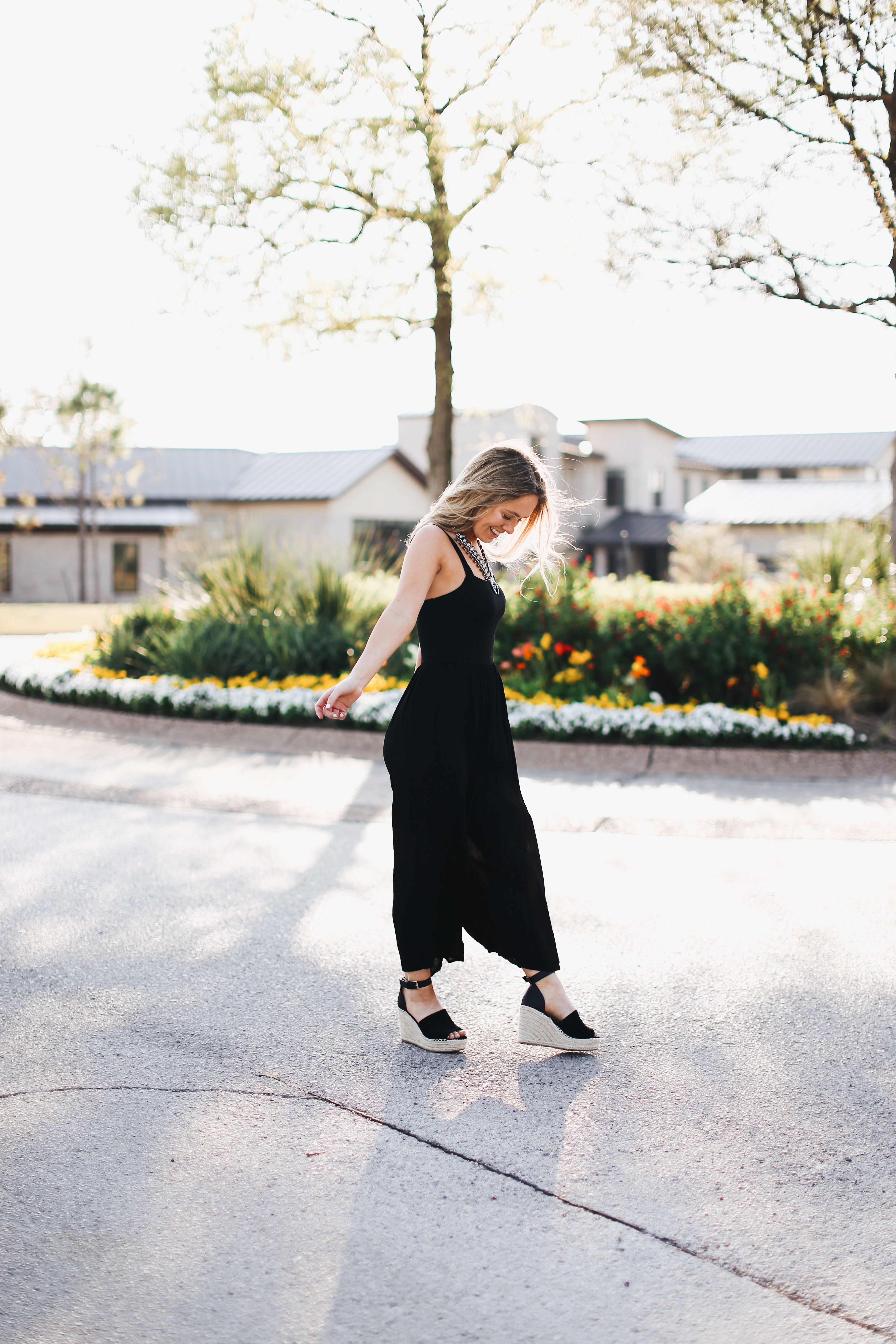 black jumpsuit with wedges