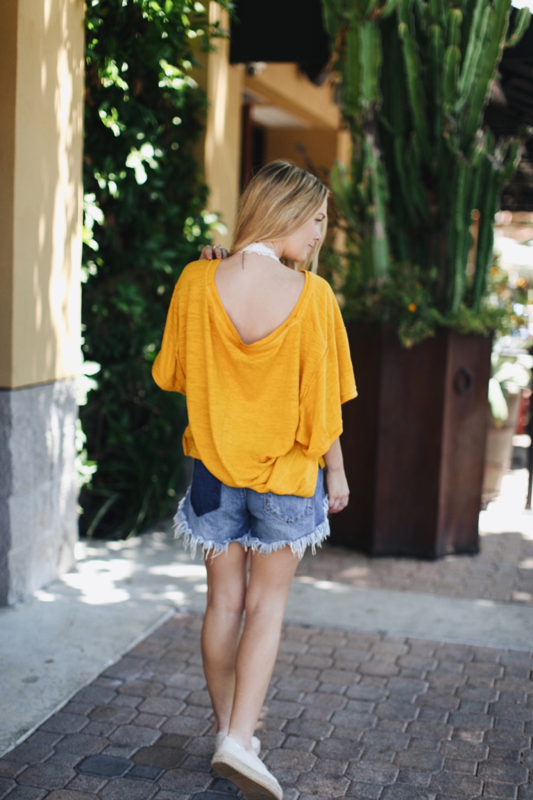 white and yellow tee